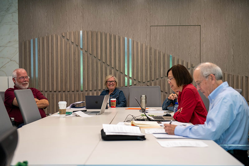 Group of UFVRA members sitting at a table, chatting together.