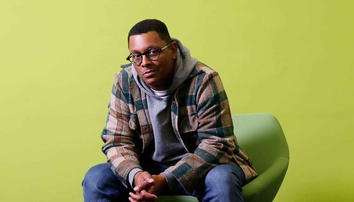 Remarkable alumni Harrison Mooney sits in a chair